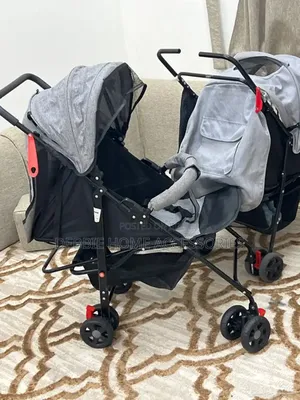 Gray and Black Umbrella Baby Stroller.