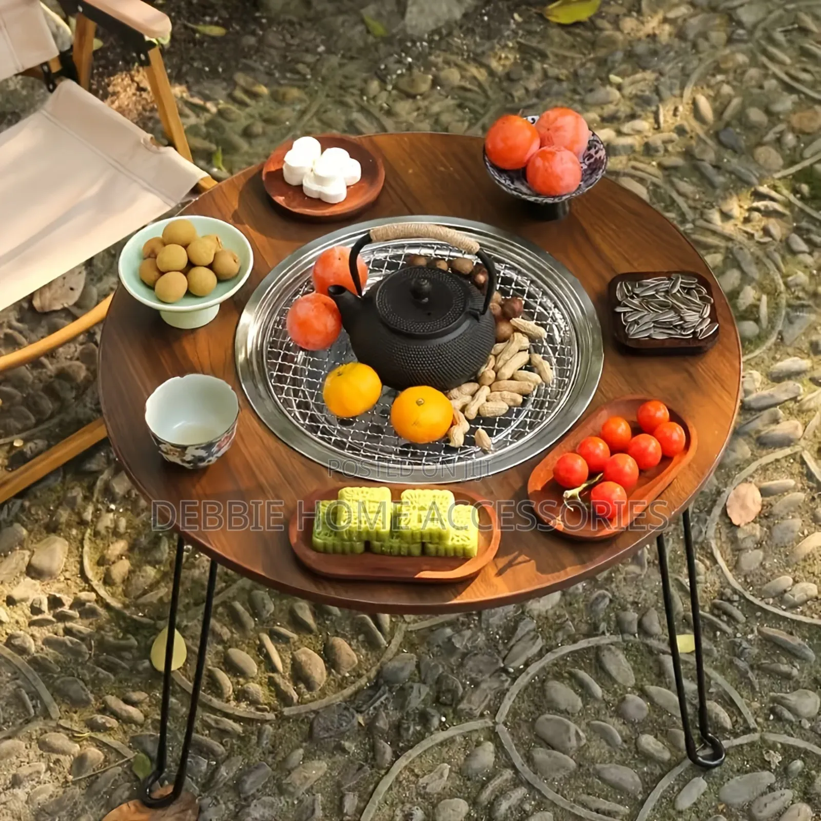 A Portable, Multifunctional Charcoal Barbecue Grill Table.