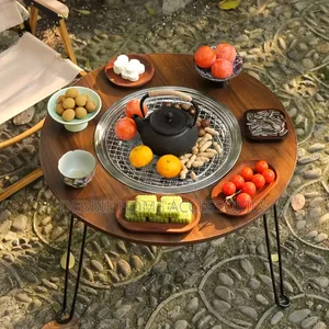 A Portable, Multifunctional Charcoal Barbecue Grill Table.