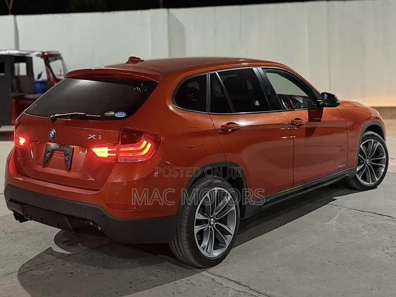 BMW X1 sDrive28i 4dr SUV (2.0L 4cyl Turbo 8A) 2014 Orange