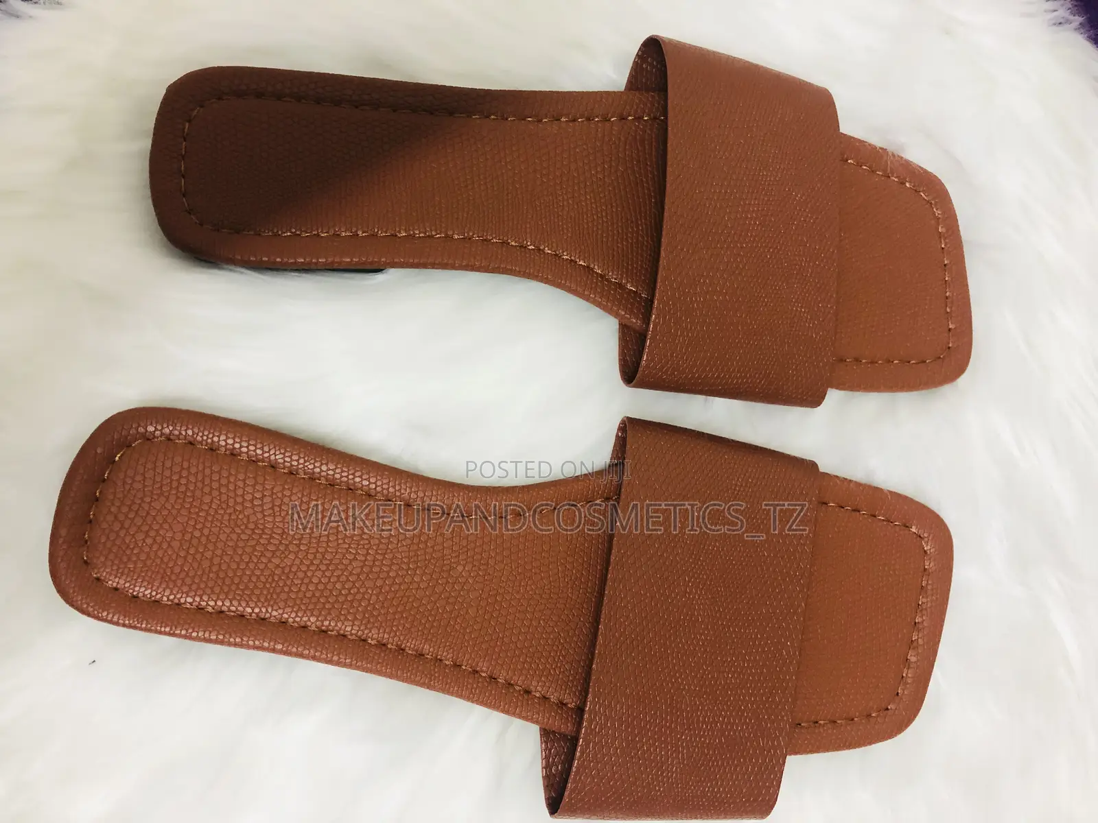 Pair of Brown Flat Slider Sandals