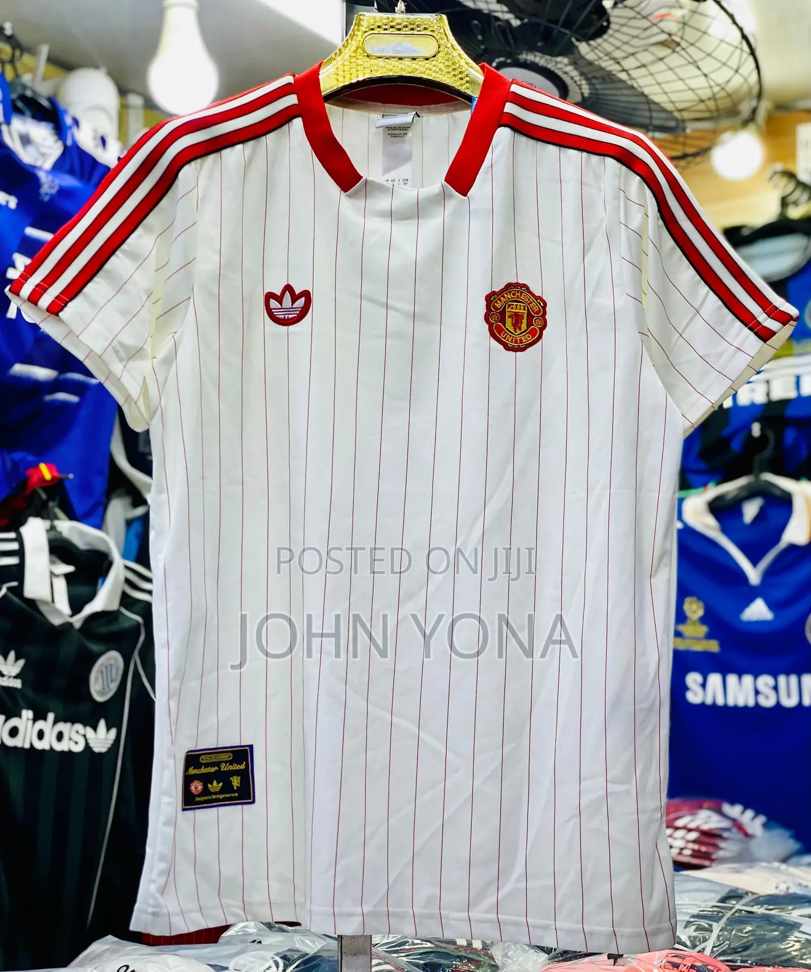 Manchester United Terrace Icons Jersey in White With Red Pinstripes.