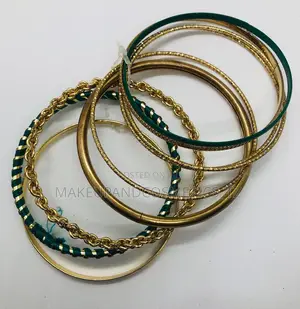 Gold-Coloured Bangle Bracelet Set With Green Detailling