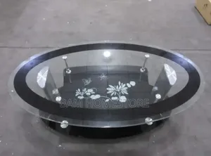 Luxury Oval Glass Coffee Table With Floral Design and Gold/Chrome Legs