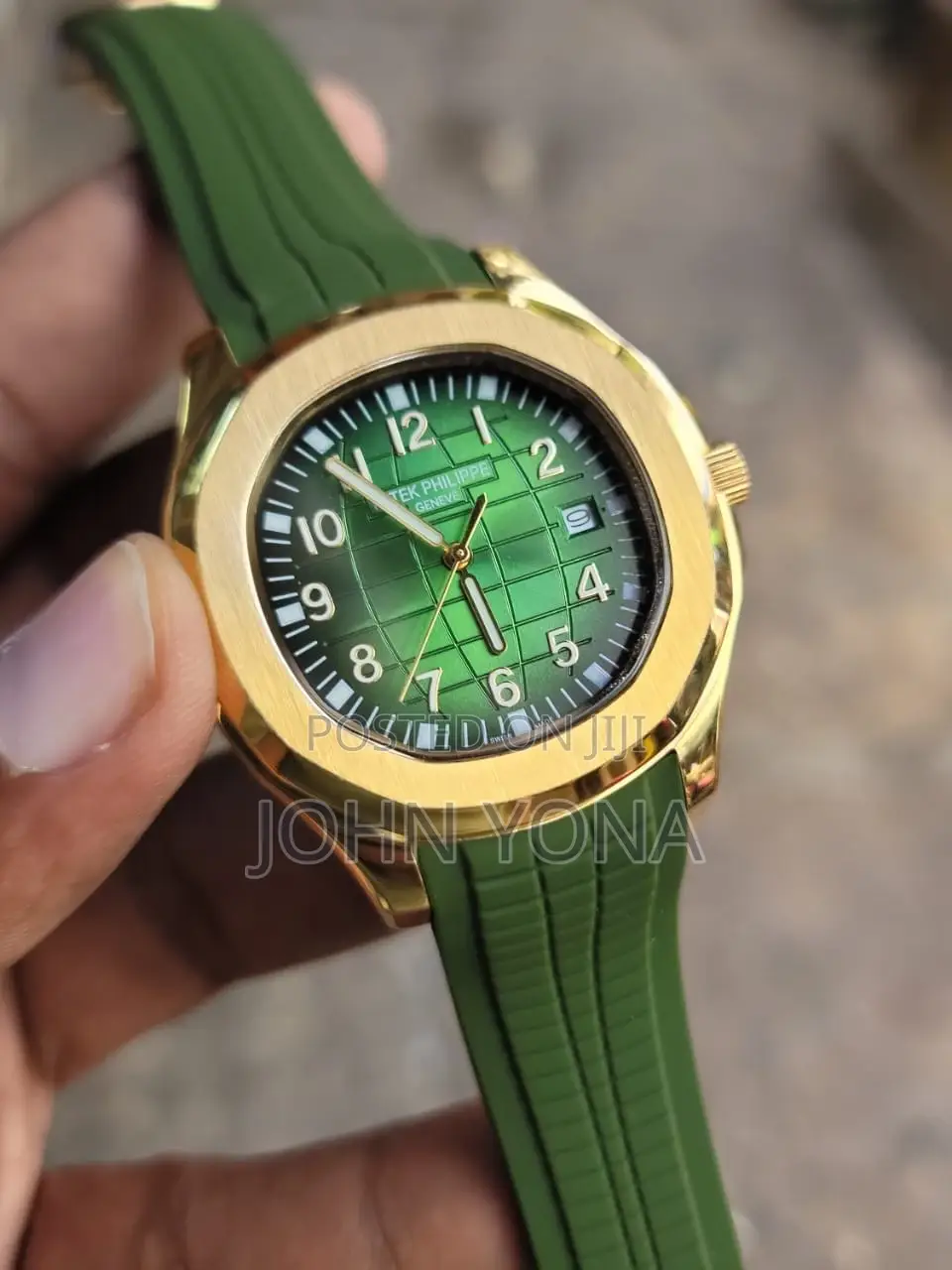 Patek Philippe Aquanaut With a Gold Case and Green Rubber Strap