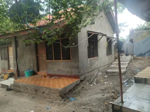 Kiwanja Chenye Nyumba Za Wapangaji Kinauzwa Mbezi Beach