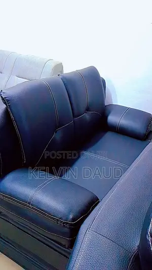 A Leather Sofa With White Stitching.