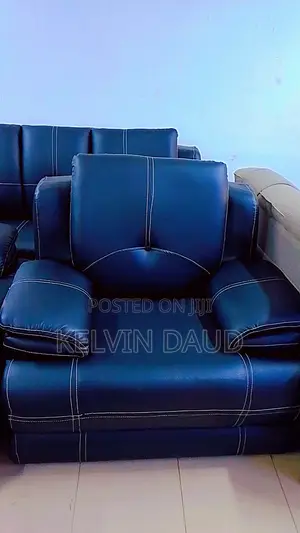 A Leather Sofa With White Stitching.