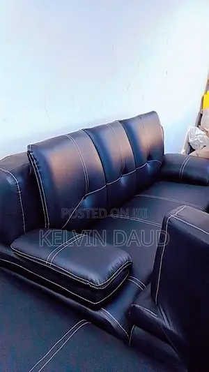 A Leather Sofa With White Stitching.