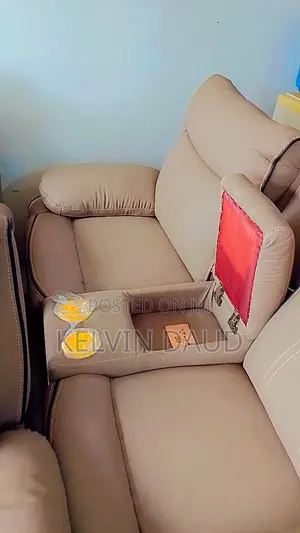 A Beige Leather Sofa With a Black Piping.