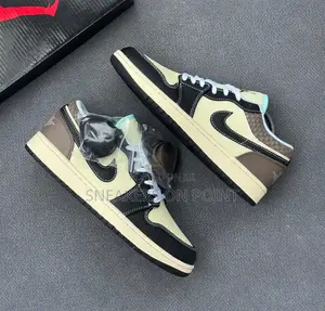 The Nike Air Jordan 1 Low Se in the “ Coconut Milk Black Muslin “