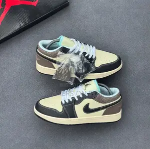 The Nike Air Jordan 1 Low Se in the “ Coconut Milk Black Muslin “