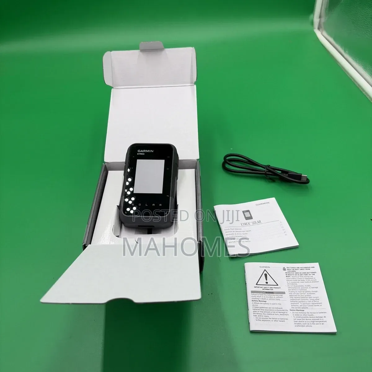Garmin E Trex Solar Handheld GPS
Navigator in Its Packaging