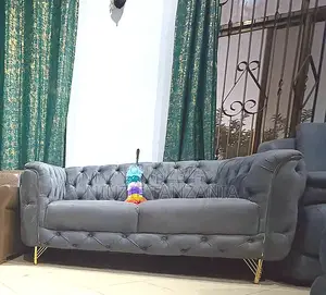 Light Blue Grayish Chesterfield With Gold Strips and Legs