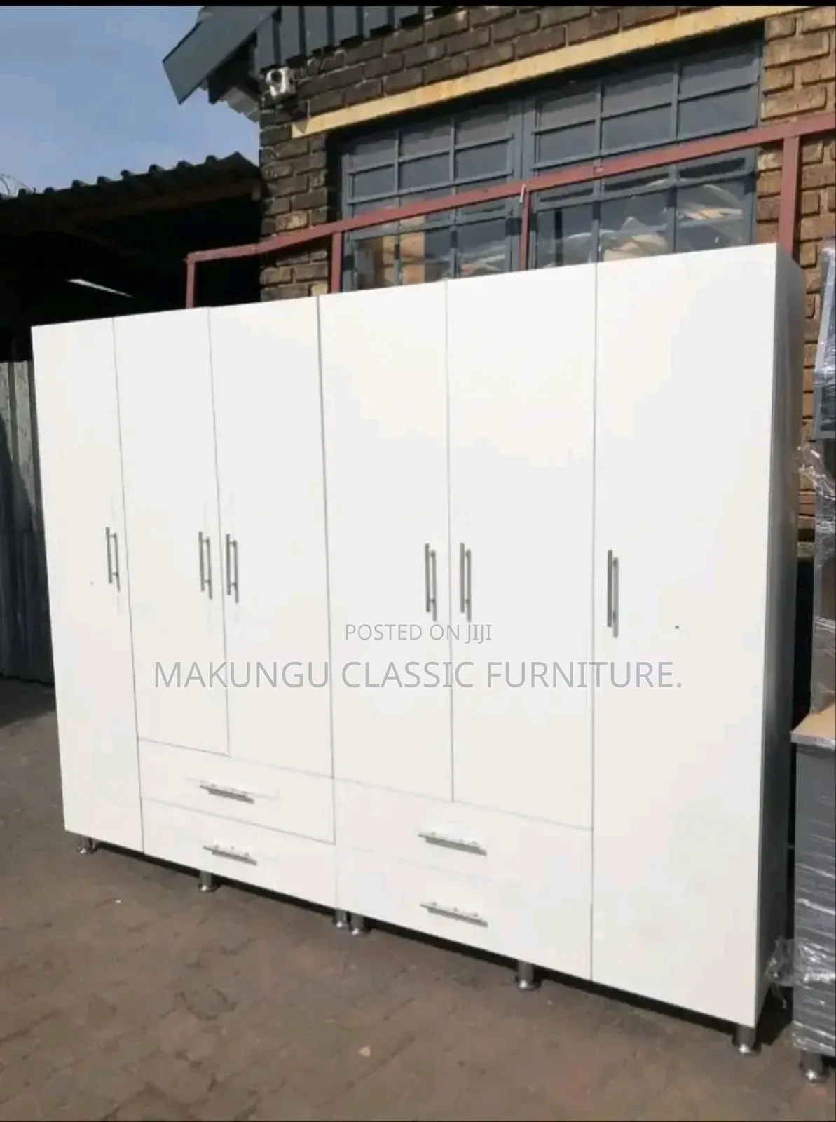 Six Doors Wardrobe With Simple White Color