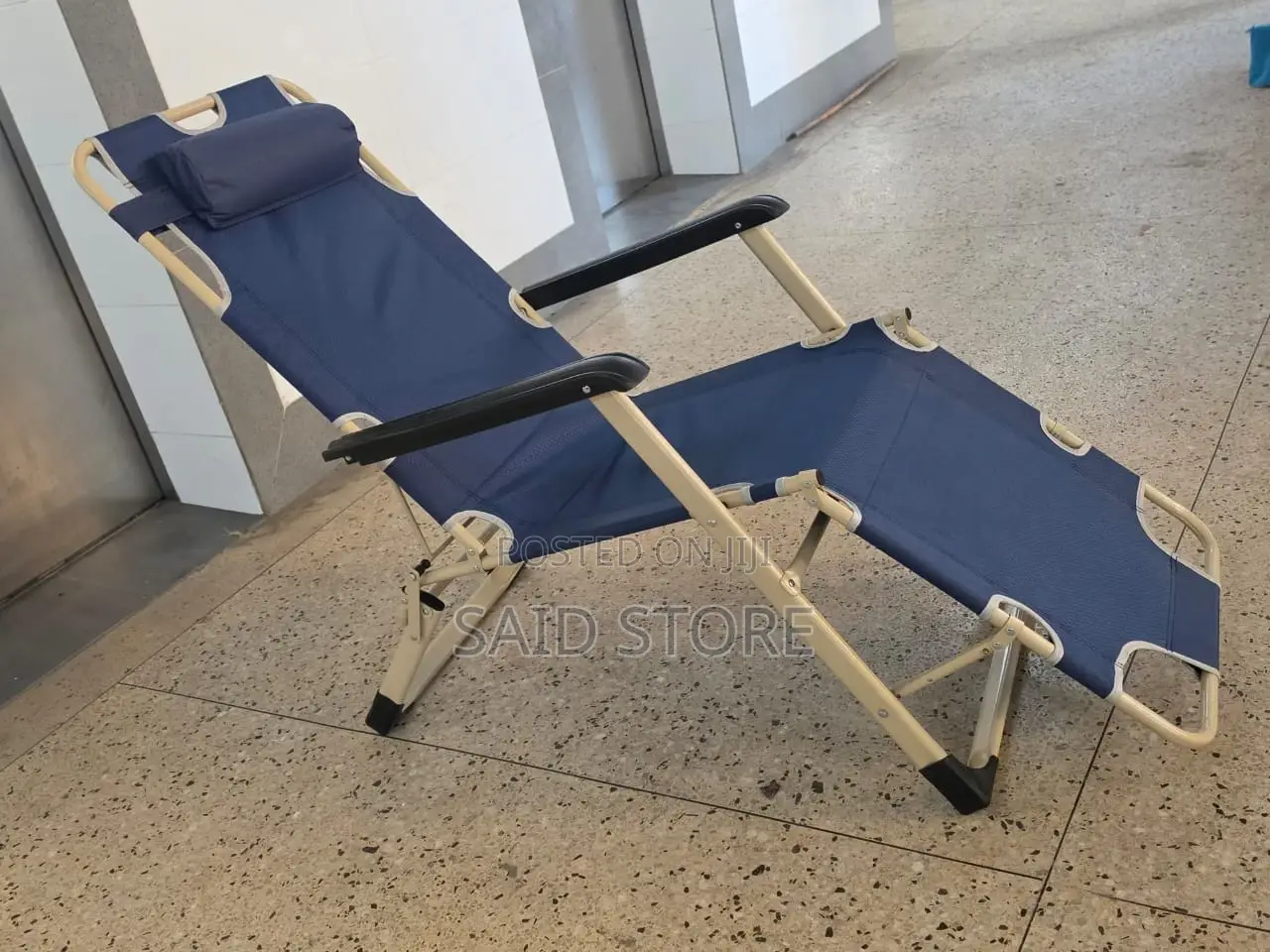 This Blue Portable Folding Beach Chair Features a Steel Frame And