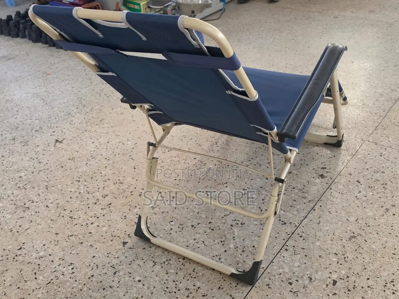 This Blue Portable Folding Beach Chair Features a Steel Frame And