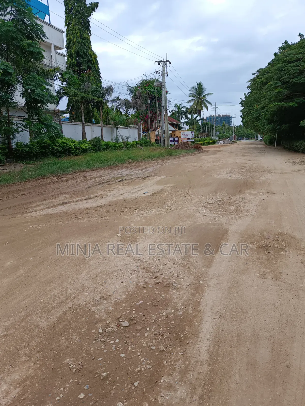 Plot for Sale in Masaki With the Building Inside the Compound