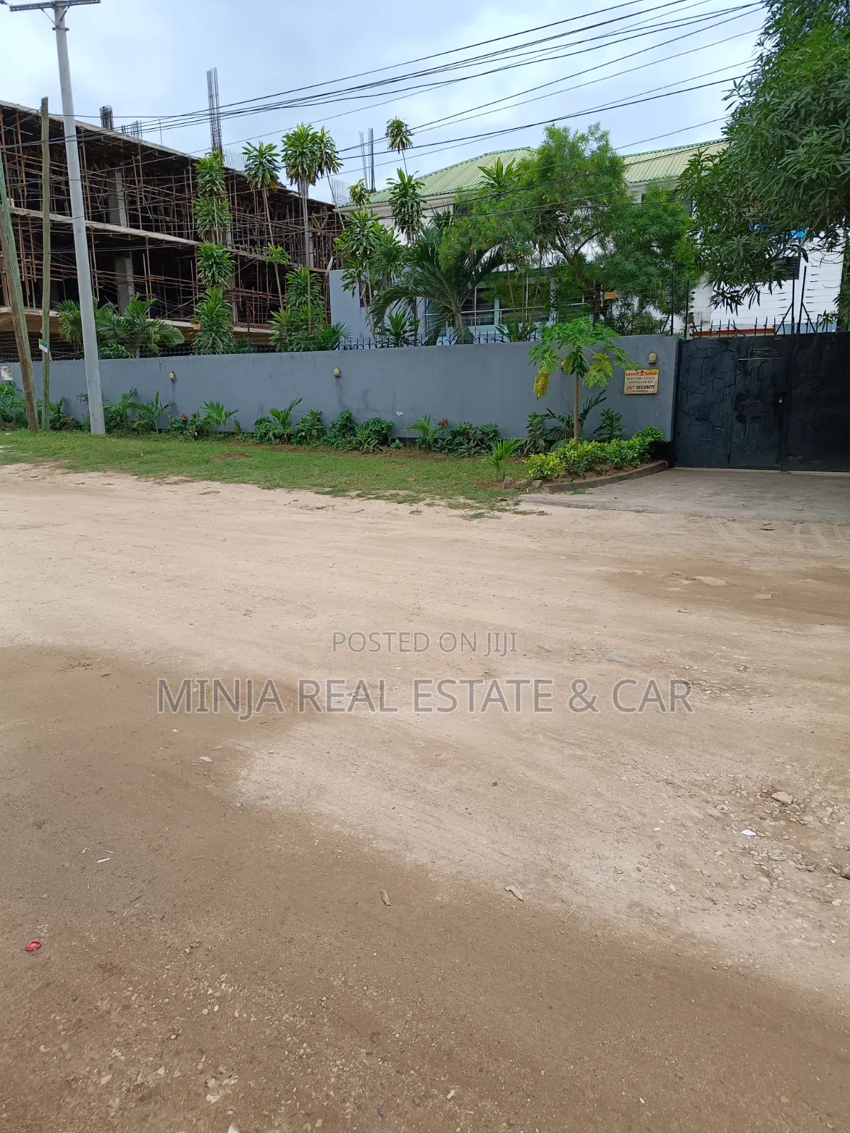 Plot for Sale in Masaki With the Building Inside the Compound