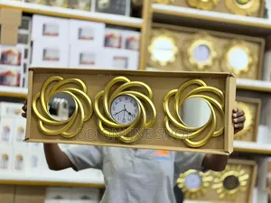 3-in-1 Wall Clock and Mirror Set 1 Clock and 2 Decorative Mirrors.