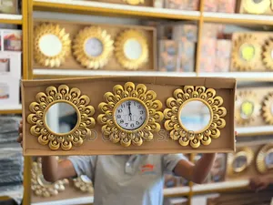 3-in-1 Wall Clock and Mirror Set 1 Clock and 2 Decorative Mirrors.