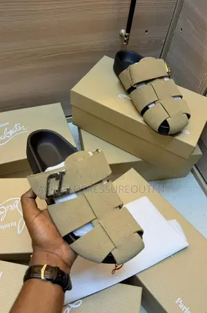 Christian Louboutin Sandal Are Beige Suede and Cl Branded Strap Detail