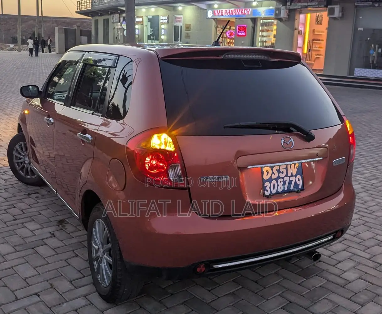 Mazda Verisa 2013 Maroon