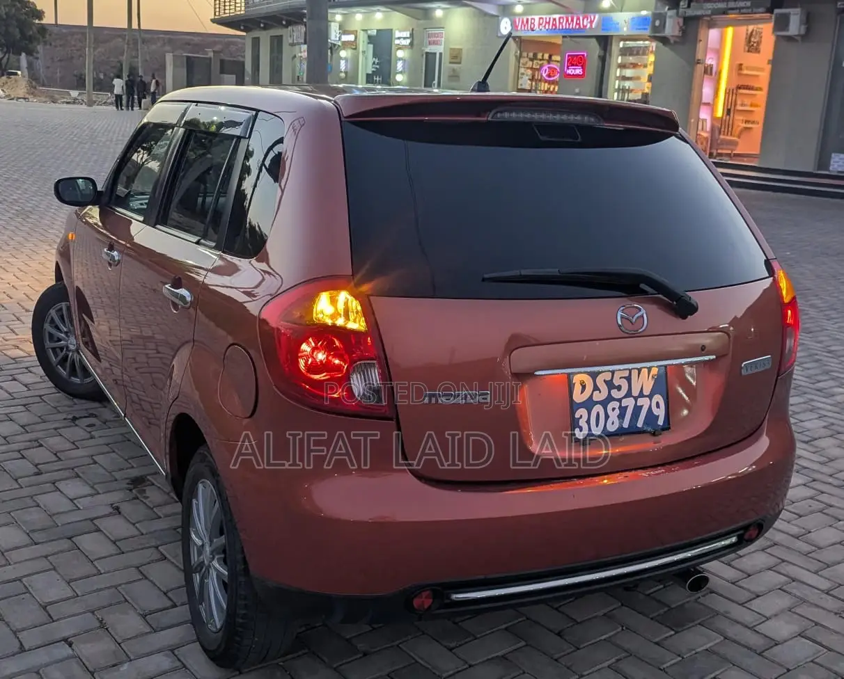 Mazda Verisa 2013 Maroon