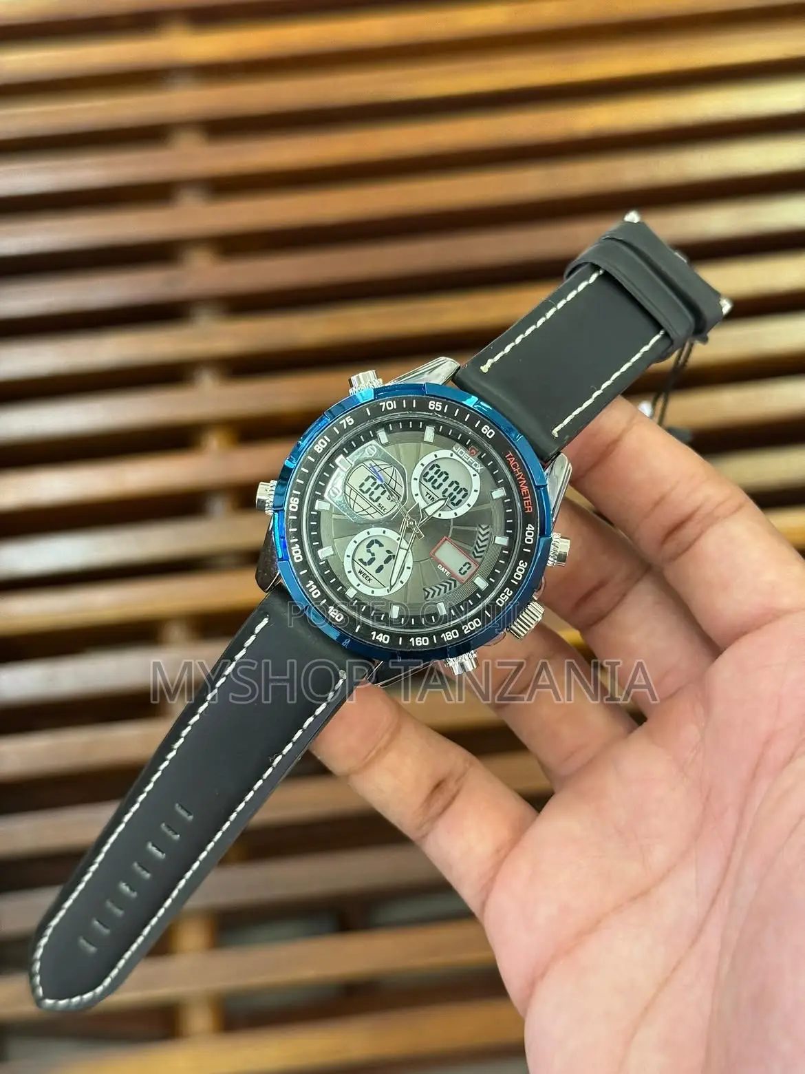 Sporty Watch Features Blue Bezel and Comfortable Black Silicone Strap