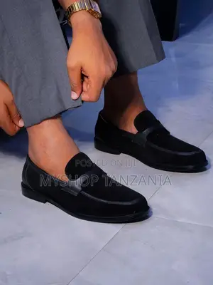 Black Slip-on Loafers Feature a Classic Penny