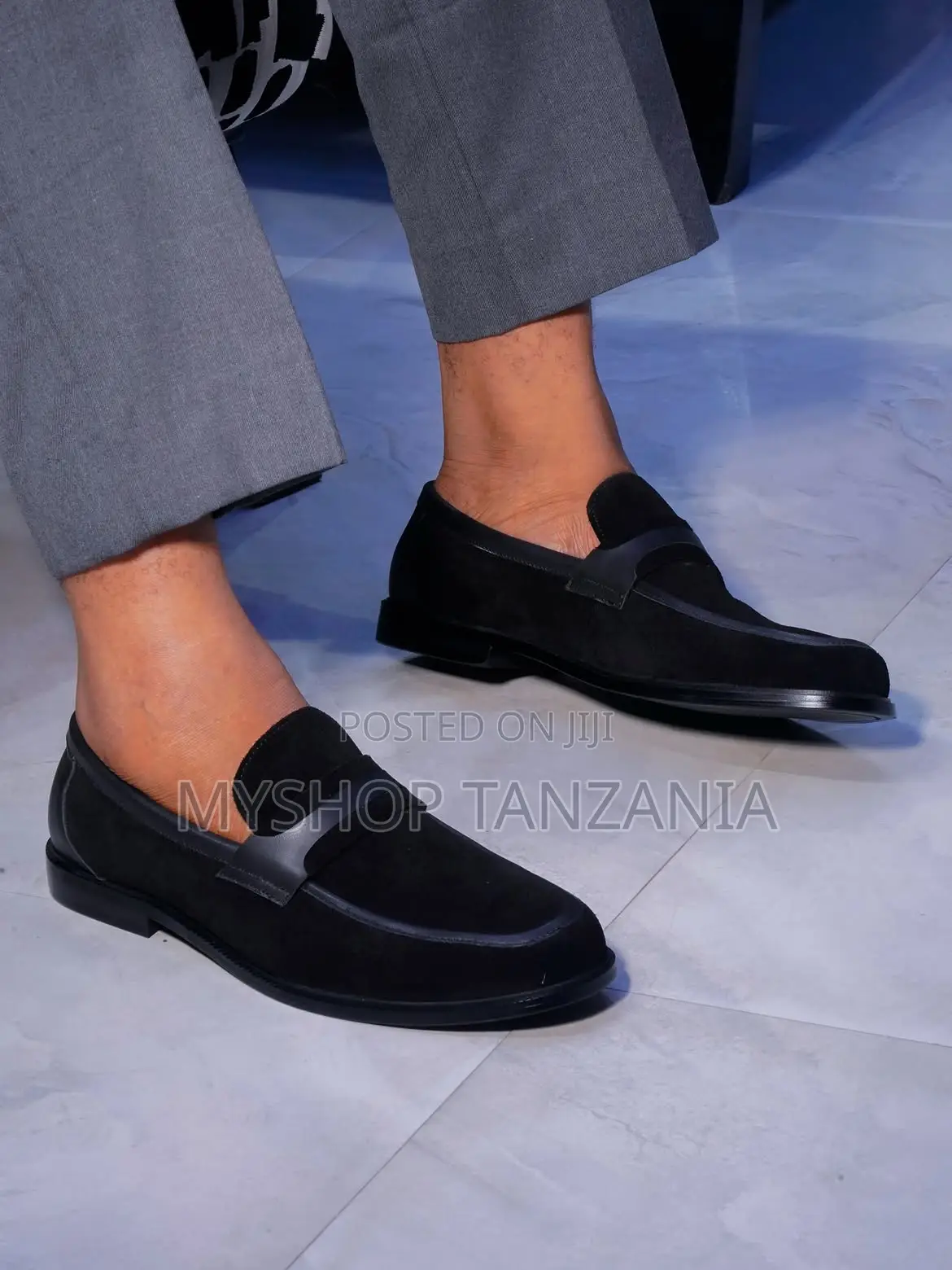 Black Slip-on Loafers Feature a Classic Penny