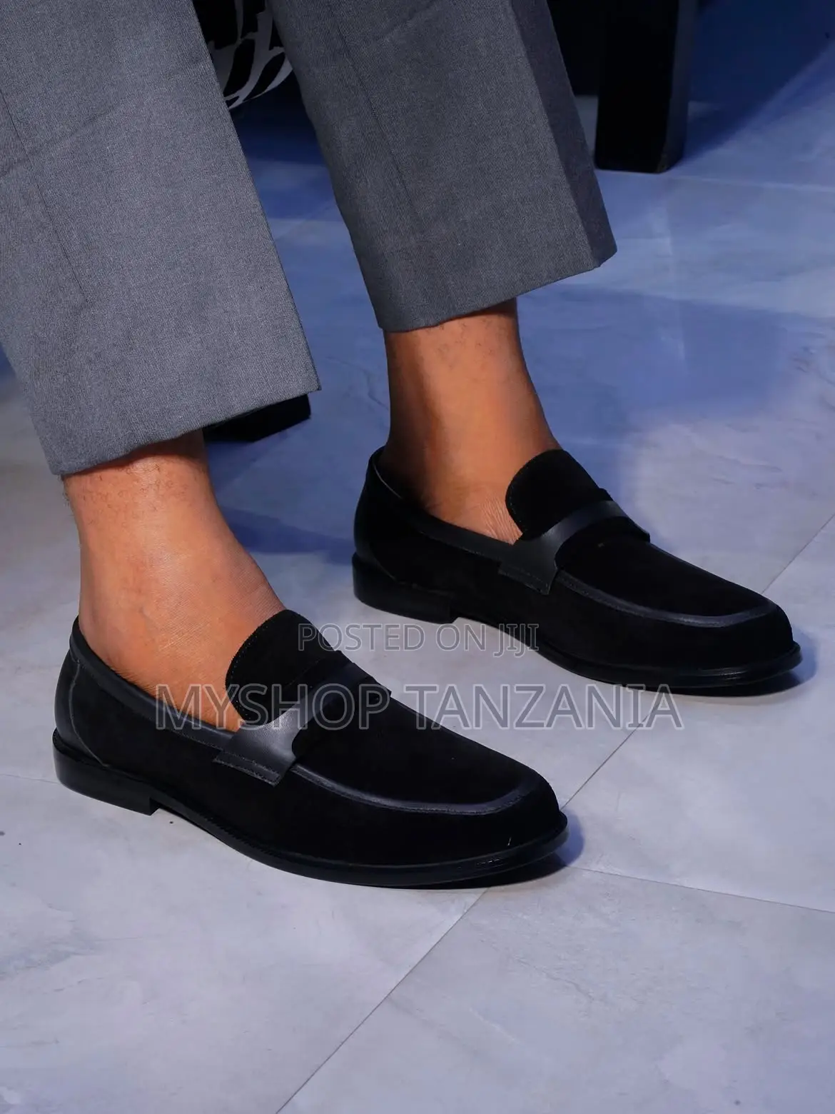 Black Slip-on Loafers Feature a Classic Penny