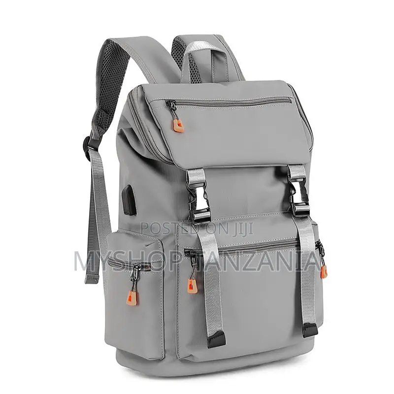 Gray Backpack Features a USB Charging Port and Quick-Release Buckles