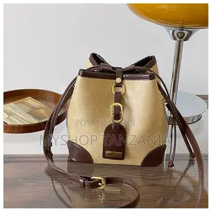 Neutral Bucket Handbag Features Dark Brown Leather Trim