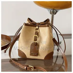 Neutral Bucket Handbag Features Dark Brown Leather Trim