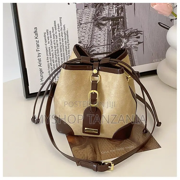 Neutral Bucket Handbag Features Dark Brown Leather Trim