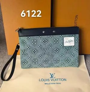 Louis Vuitton Pochette Voyage Souple Crafted With Natural Leather Trim