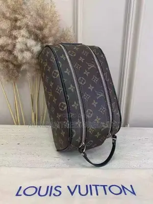 Louis Vuitton Doppkit Feature Embossed Iconic Monogram Pattern