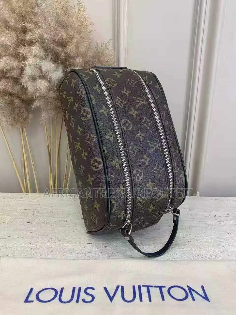 Louis Vuitton Doppkit Feature Embossed Iconic Monogram Pattern