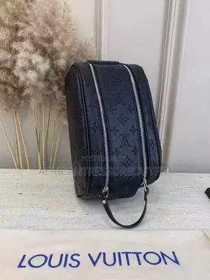 Louis Vuitton Doppkit Feature Embossed Iconic Monogram Pattern