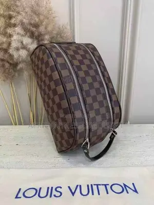 Louis Vuitton Doppkit Feature Embossed Iconic Monogram Pattern