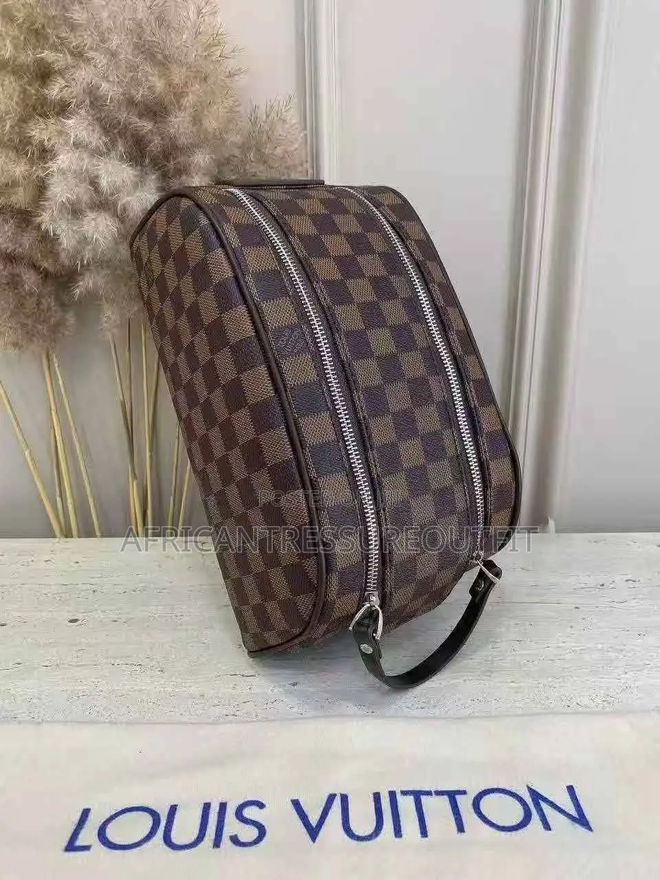 Louis Vuitton Doppkit Feature Embossed Iconic Monogram Pattern