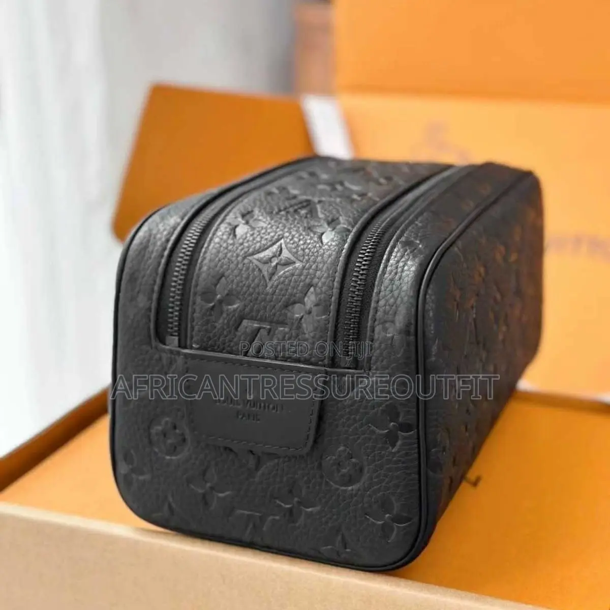 Louis Vuitton Doppkit Feature Embossed Iconic Monogram Pattern