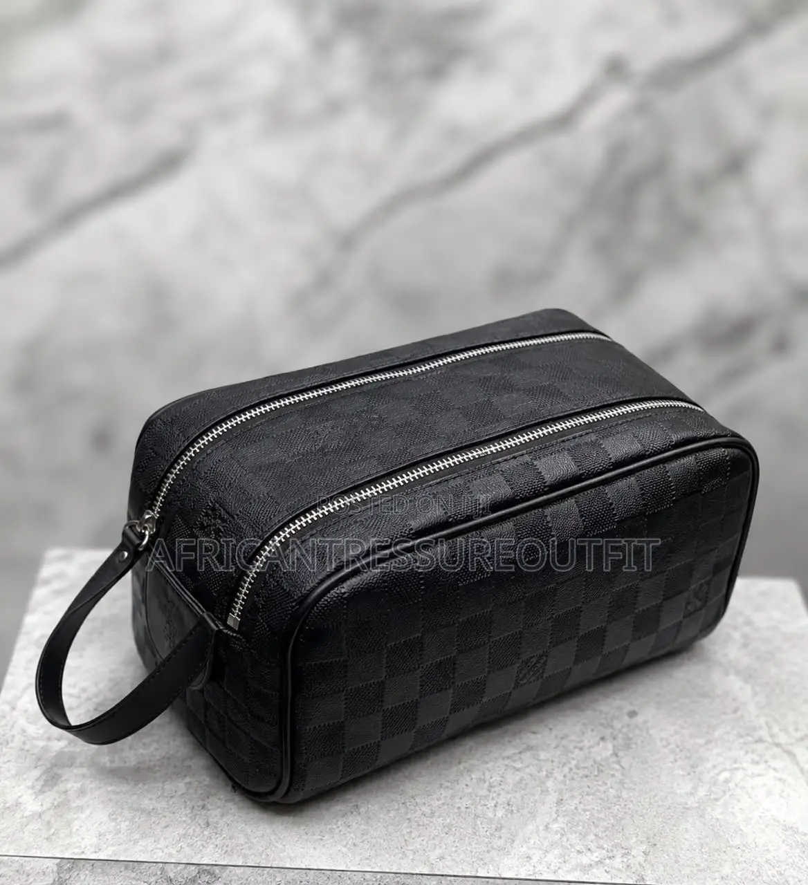 Louis Vuitton Doppkit Feature Embossed Iconic Monogram Pattern