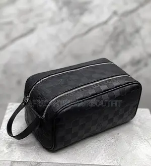Louis Vuitton Doppkit Feature Embossed Iconic Monogram Pattern