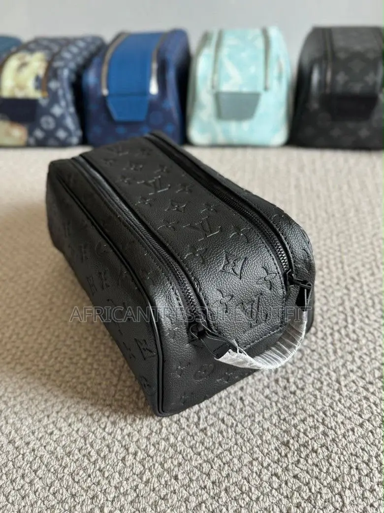 Louis Vuitton Doppkit Feature Embossed Iconic Monogram Pattern
