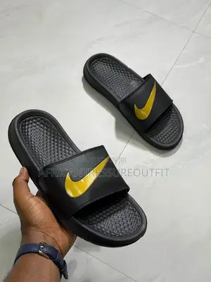 NIKE BENASSI SLIDES Feature a Textured Footbed