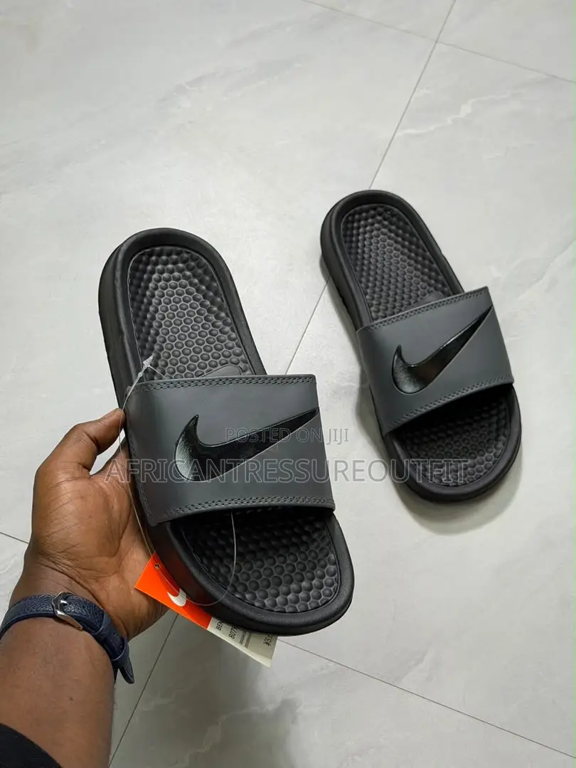 NIKE BENASSI SLIDES Feature a Textured Footbed