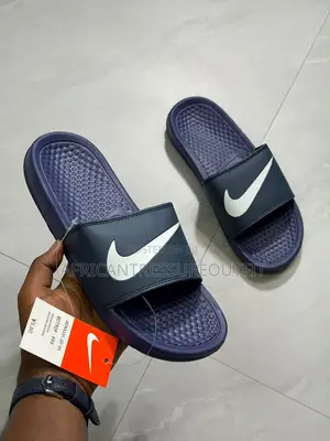 NIKE BENASSI SLIDES Feature a Textured Footbed
