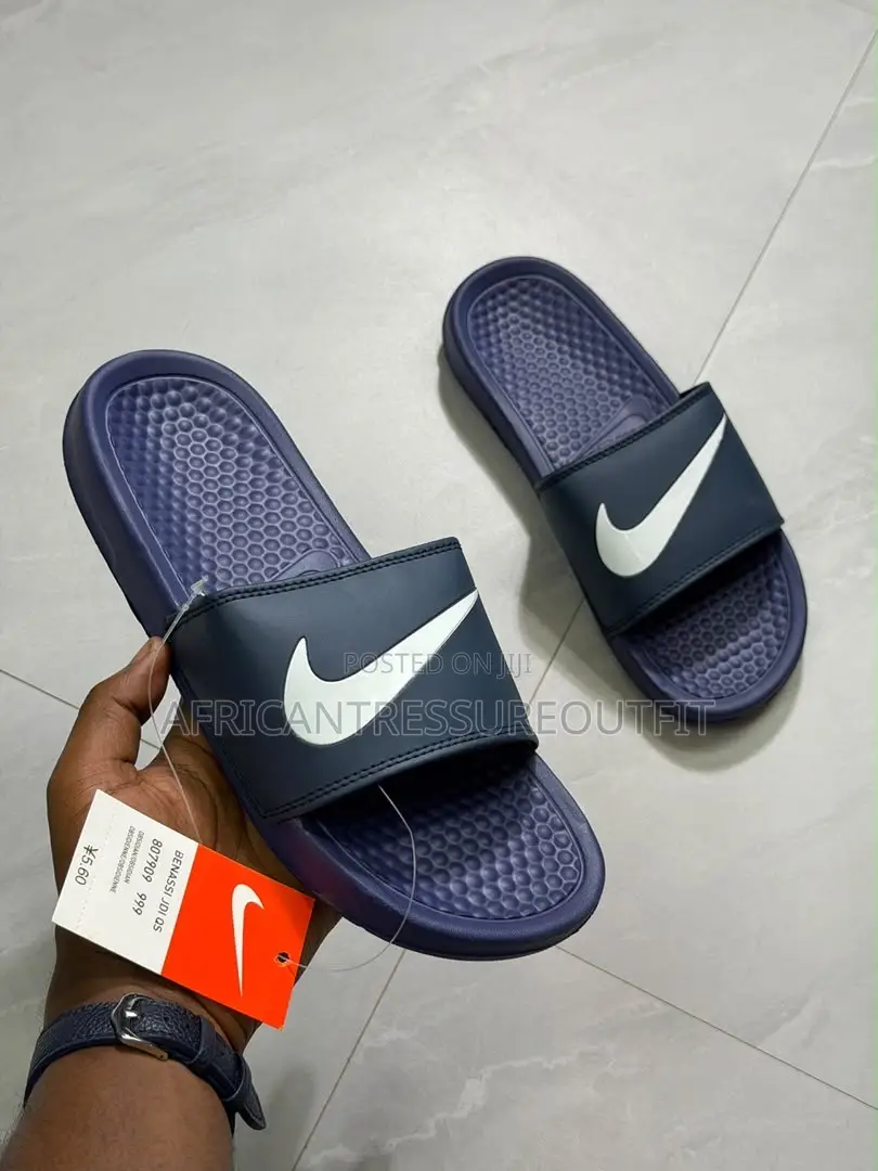 NIKE BENASSI SLIDES Feature a Textured Footbed